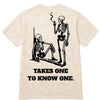 House of Paper Clothing beige shirt with two skeletons and 'Takes One to Know One' text on back